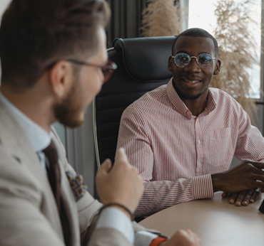 Consultants meeting with a client
